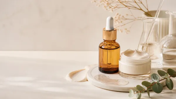Retinol eye serum and eye cream on a bright clinical skincare surface